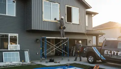 Technician installing energy-efficient vinyl windows on Columbus OH home exterior